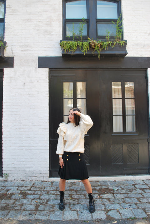 Cream cableknit ruffled sweater