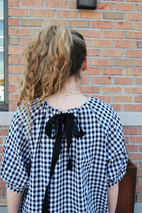 Check tie back dress
